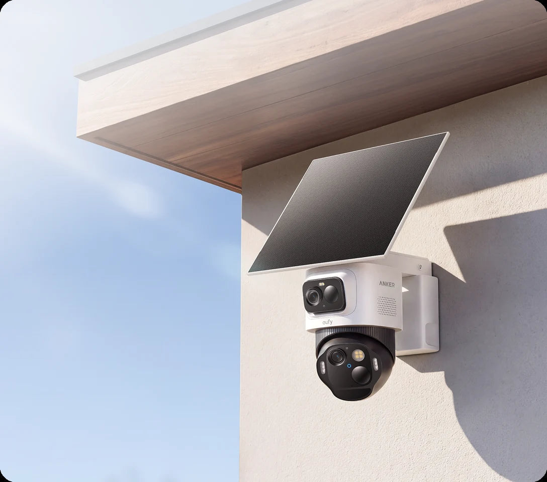 eufyCam E52 fixed and pan-and-tilt cameras with a solar panel, mounted under an eave