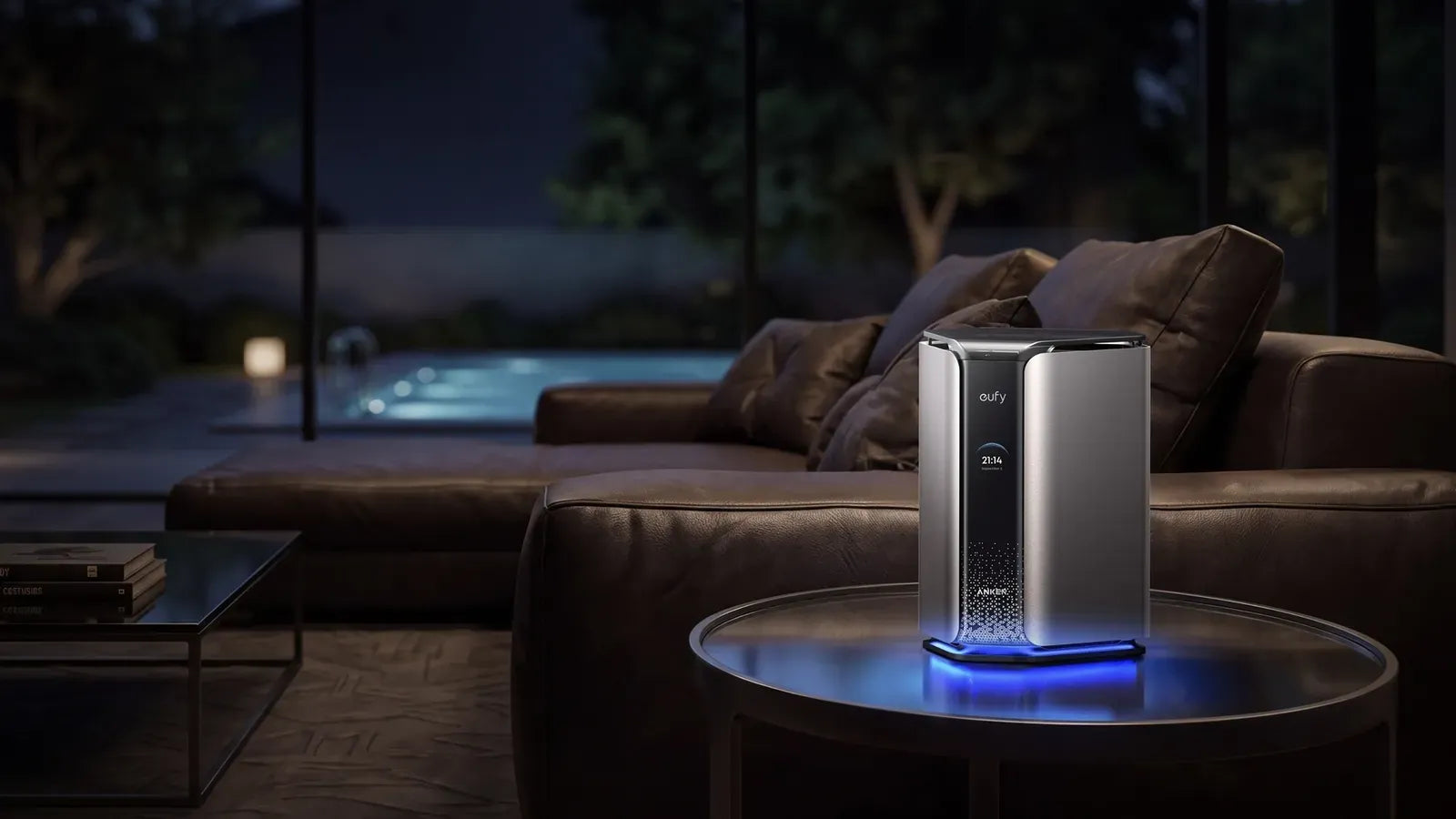 Anker MindBase on a glass table in a living room at dusk